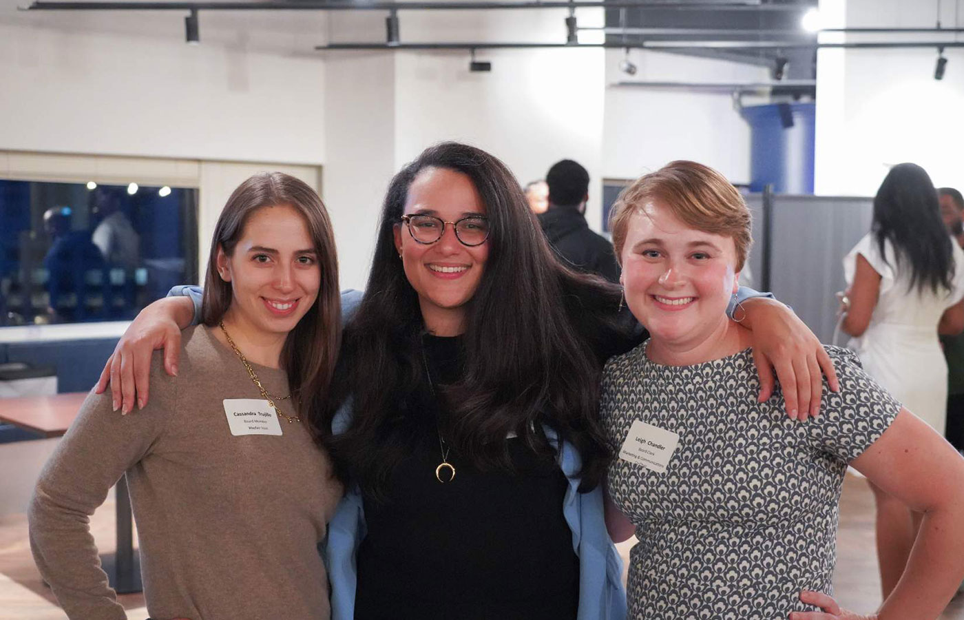 3-smiling-women-with-arms-around-each-other